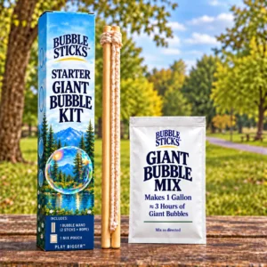 Bubble Sticks Starter Giant Bubble Kit with one wooden rope-loop wand set, one giant bubble mix pouch and blue scenic box in a park